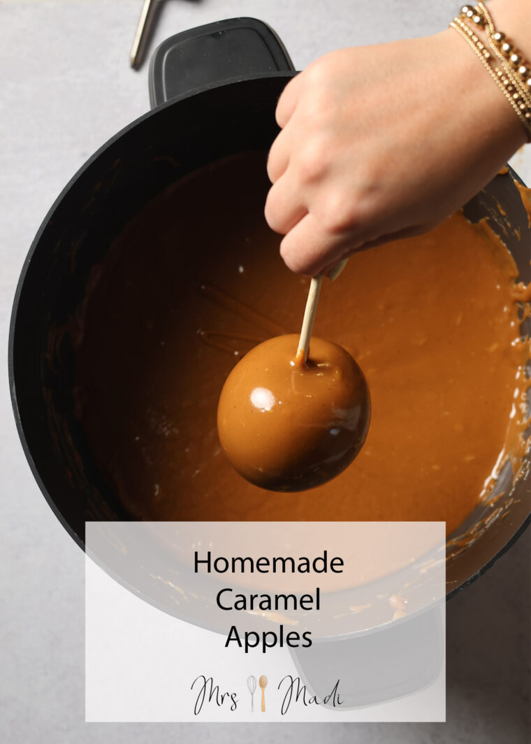 Someone&rsquo;s dunking an apple on a stick into gooey caramel. Text says Homemade Caramel Apples Mrs Madi.