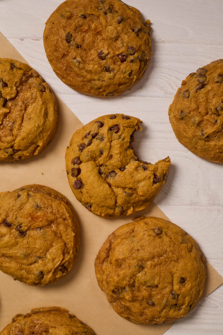 pumpkin chocolate chip cookies with a bite out 