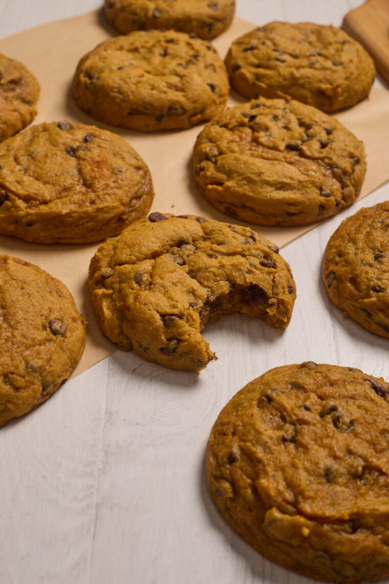 pumpkin chocolate chip cookies with a bite out