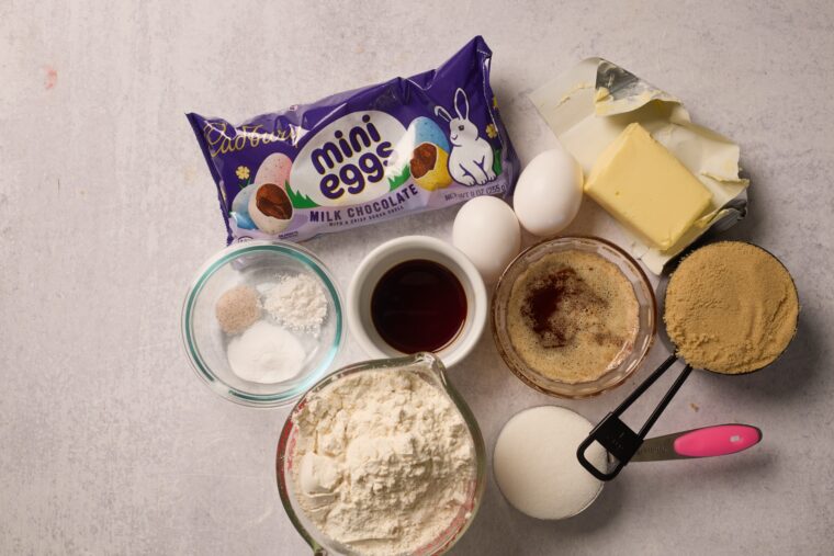 All the essentials for browned butter Cadbury egg blondies—Mini Eggs, eggs, butter, sugars, flour, vanilla, baking powder.
