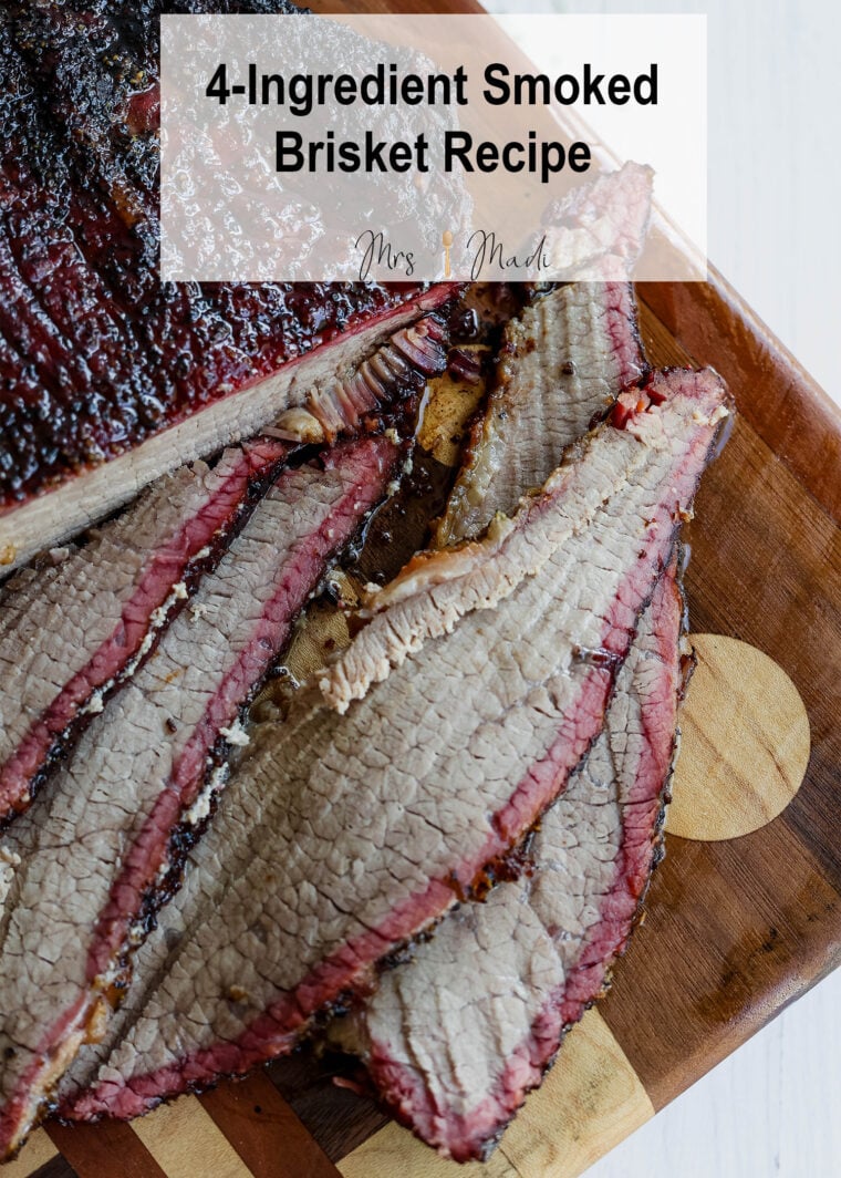 Sliced brisket served up on a wooden board, with the text: 4-Ingredient Smoked Brisket Recipe.