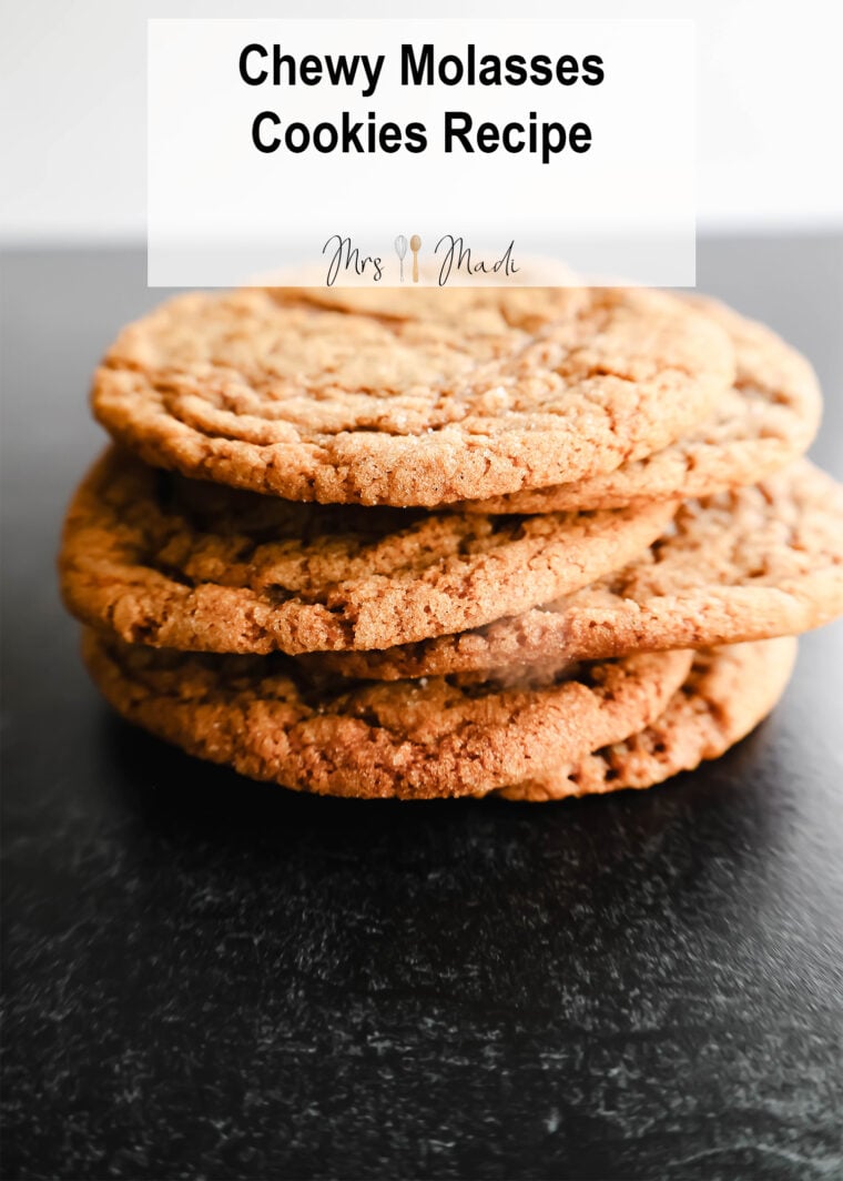 A bunch of soft and chewy molasses cookies are chilling on a dark background. Up top, theres some text that says Soft and Chewy Molasses Cookies Recipe.
