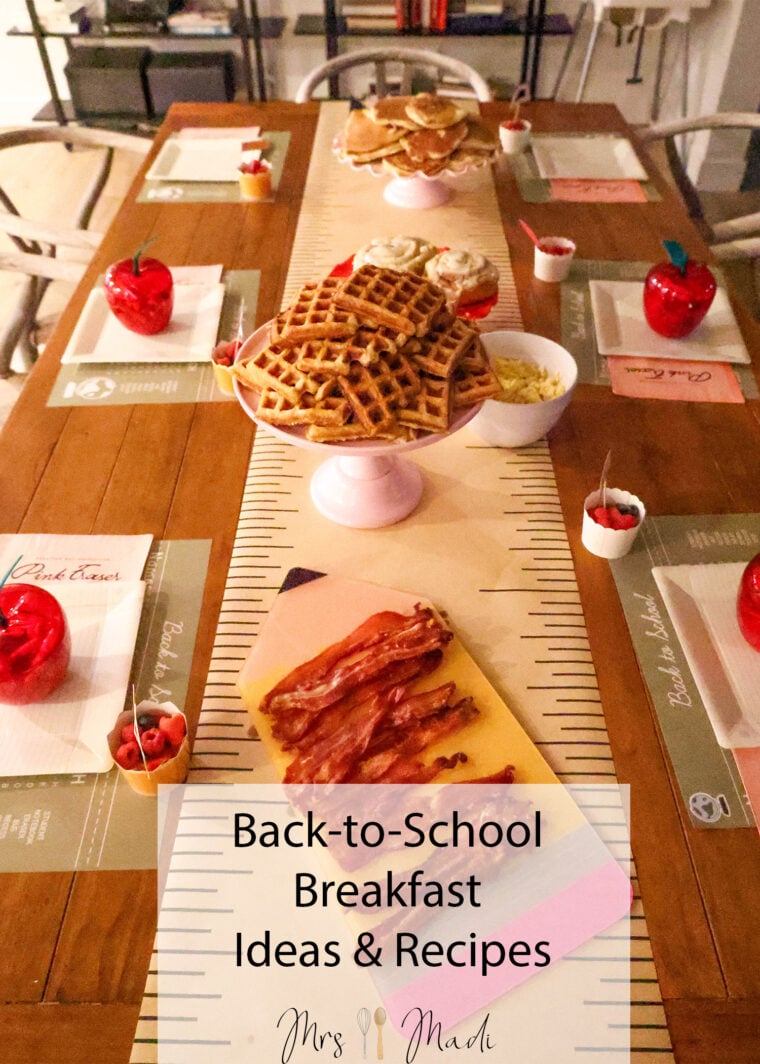 A table’s ready for a back-to-school breakfast—there’s waffles, bacon, fruit, and cute apple-shaped containers on placemats that look like notebook paper. There’s even a sign that says Back-to-School Breakfast Ideas & Recipes.