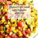 A zesty charred corn salad loaded with cherry tomatoes, avocado, cilantro, and a squeeze of lime. Text on top: “Charred Corn Salad with Avocado and Lime – Mrs i Made.”.
