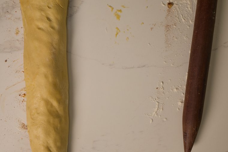 cinnamon roll dough rolled up into a log