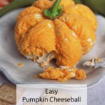 Partially eaten pumpkin-shaped cheeseball on a plate with a cracker and knife. Text: Easy Pumpkin Cheeseball for Fall Parties.