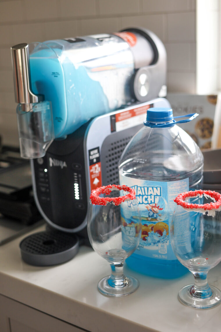 On the kitchen counter, there&rsquo;s a slushie machine, big bottle of blue Hawaiian Punch, and two glasses with red sugar rims.