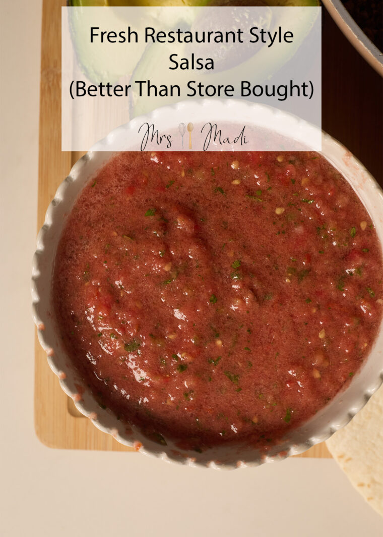 A white bowl packed with zesty salsa sits on a wooden board. Above it: &ldquo;Fresh Restaurant Style Salsa (Better Than Store Bought).&rdquo;.