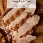Juicy, perfectly seasoned smoked chicken breast slices sit on a board, with recipe text for the best smoked chicken ever.