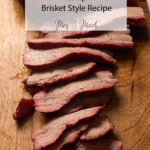 Juicy smoked tri tip slices on a wooden board, with text: "Tender Smoked Tri Tip Brisket Style - Mrs. Madi. So tasty—try it!.
