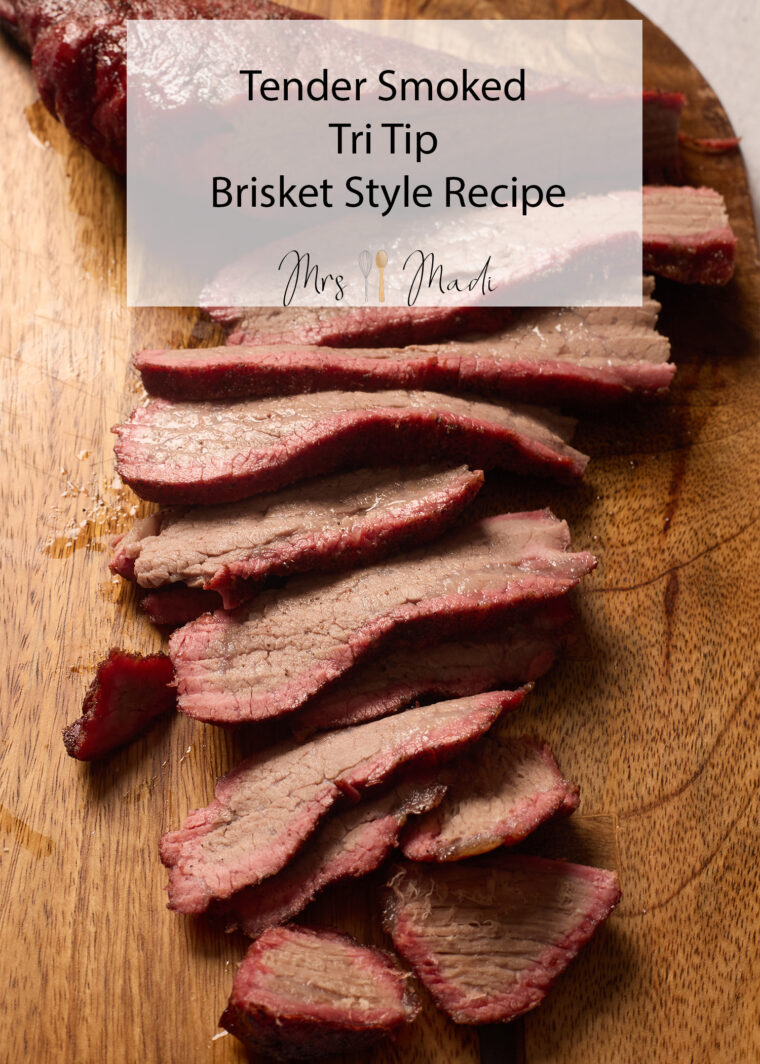 Juicy smoked tri tip slices on a wooden board, with text: "Tender Smoked Tri Tip Brisket Style - Mrs. Madi. So tasty—try it!.