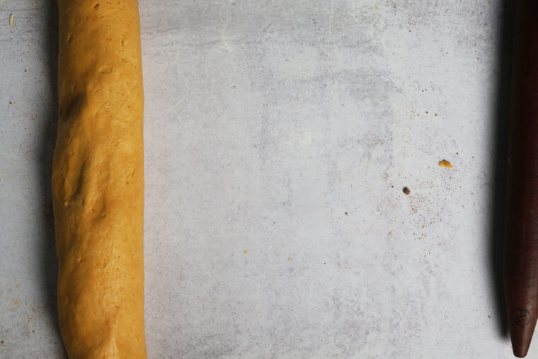 a roll of pumpkin cinnamon rolls 