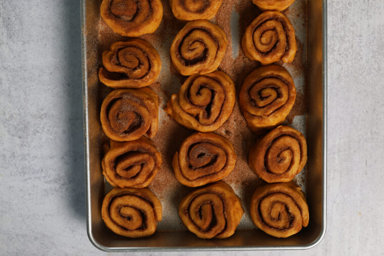 a pan of unbaked pumpkin cinnamon rolls